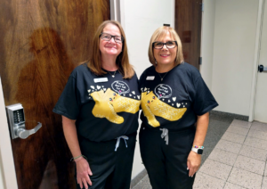 Center Administrator Donna LaCardi and Director of Nursing Charlotte Palushaj wearing the t-shirts they designed for Fall Prevention Awareness