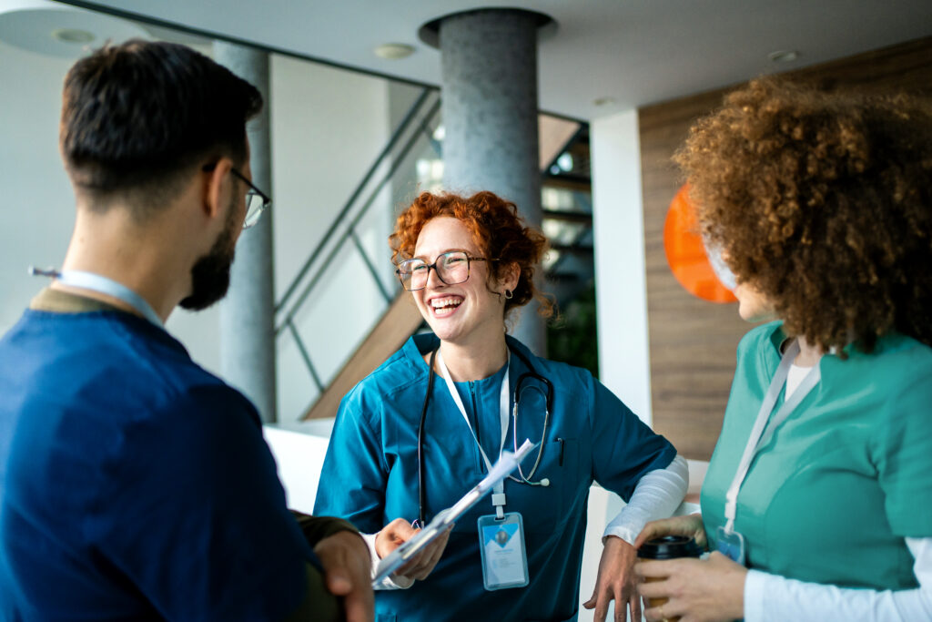 Healthcare professionals having cheerful discussion during work break